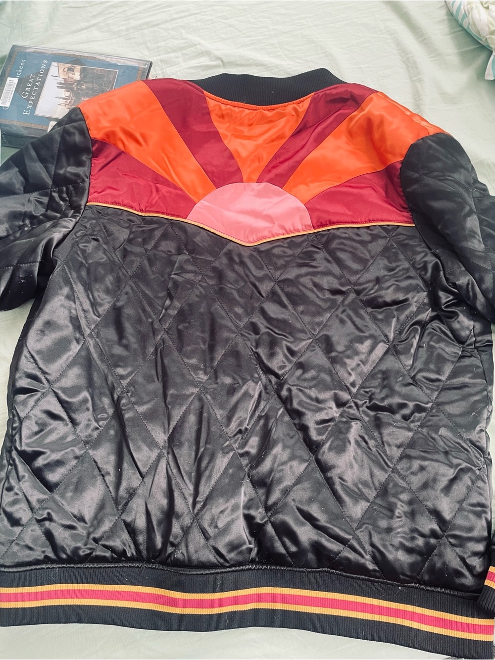 Women's Quilted Black Satin Bomber Jacket with Red & Orange Sunburst